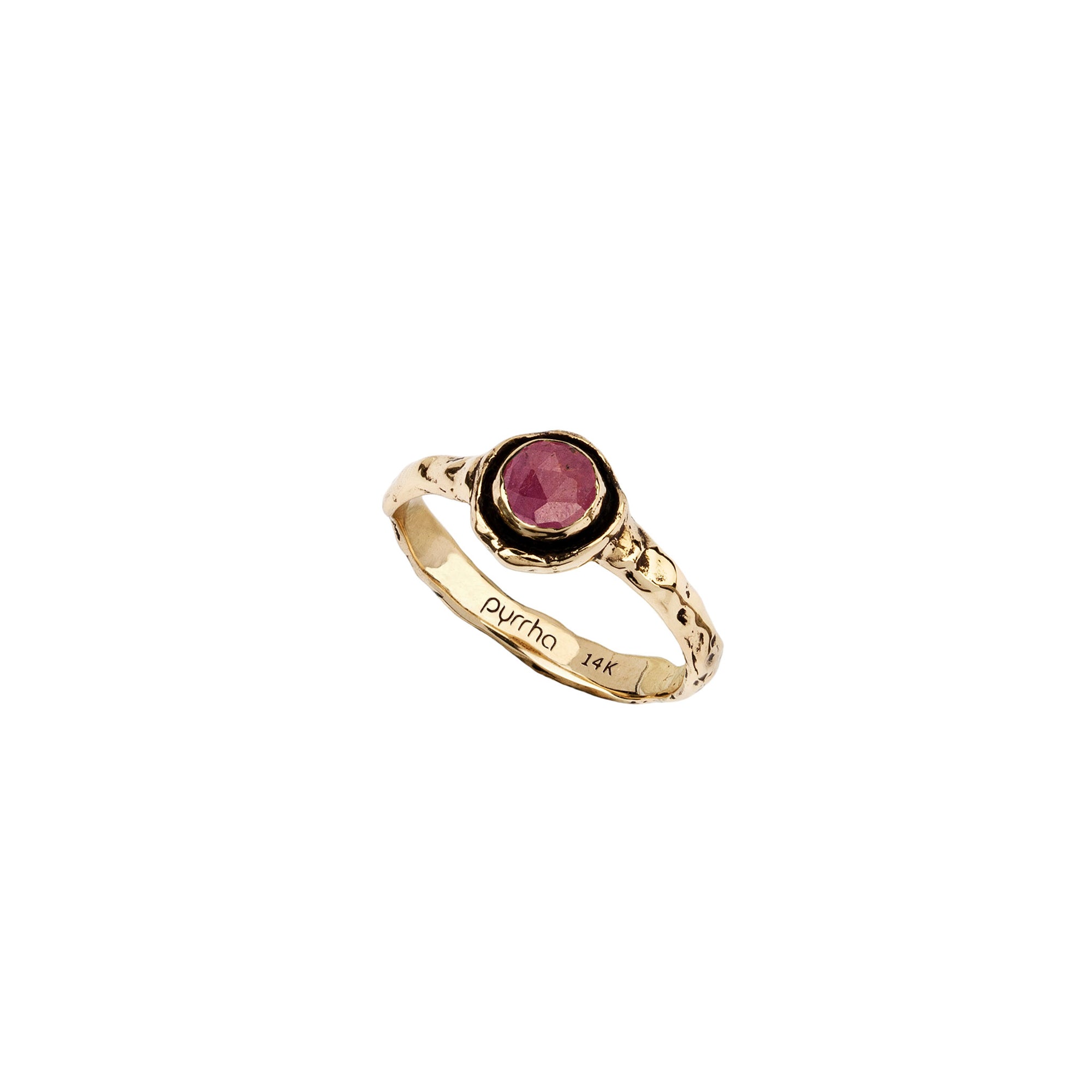 A narrow 14k gold ring set with a ruby.