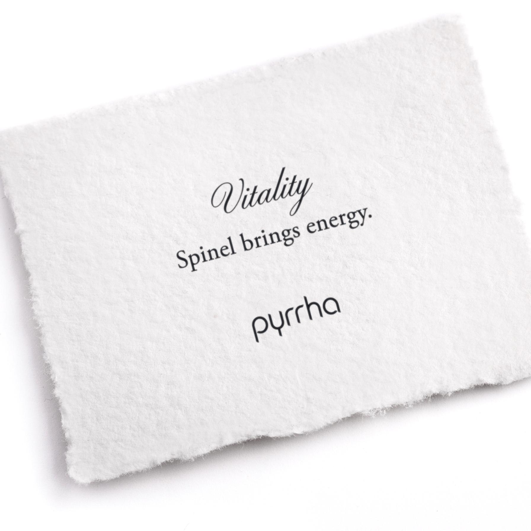 A hand-torn, letterpress printed card describing the meaning for Pyrrha's Vitality Attraction Charm