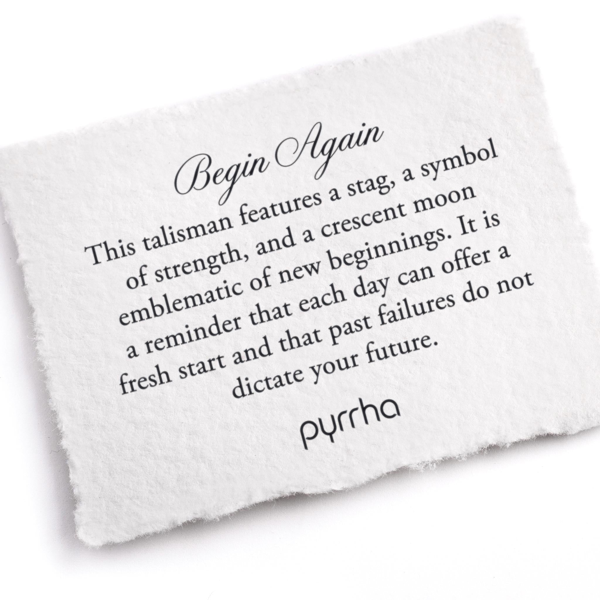 A hand-torn, letterpress printed card describing the meaning for Pyrrha's Begin Again Talisman