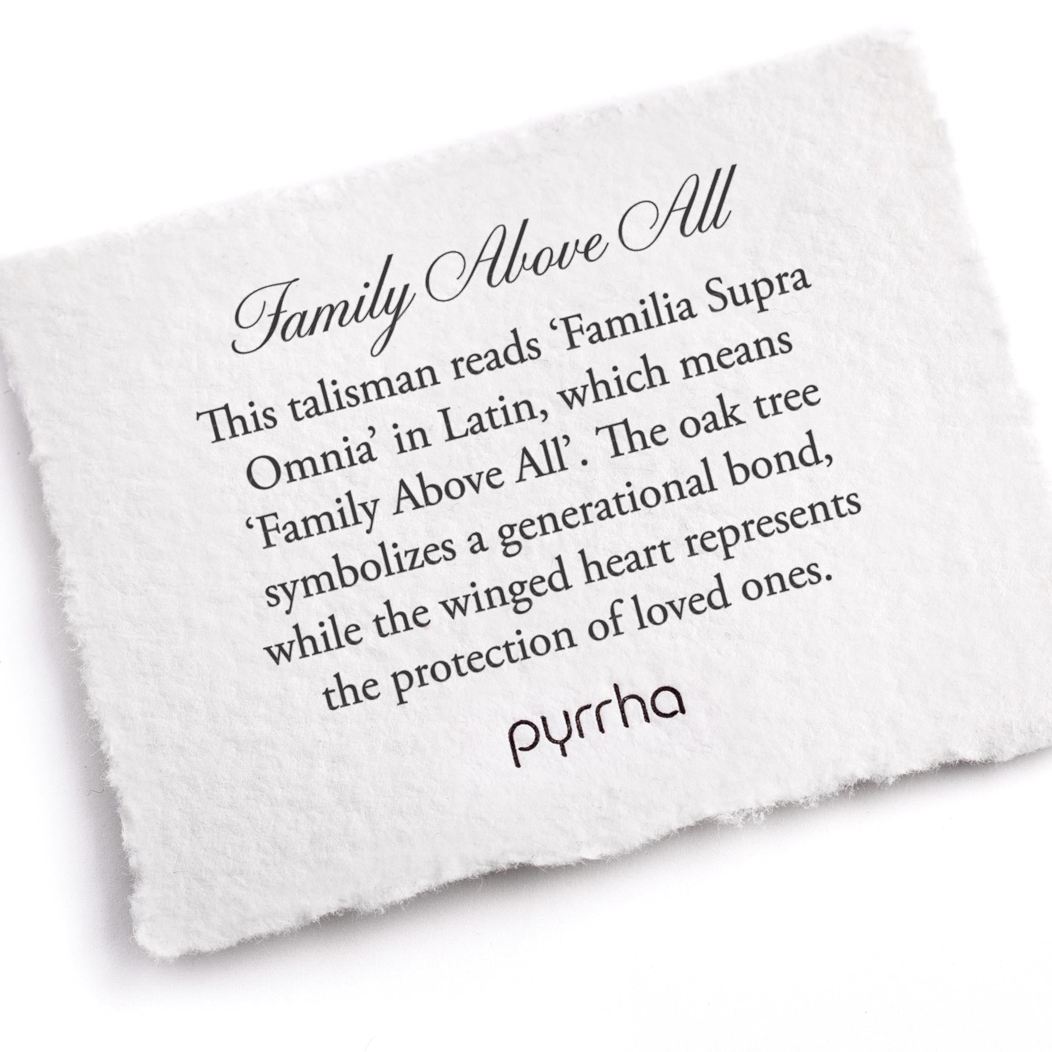 A hand-torn, letterpress printed card describing the meaning for Pyrrha's Family Above All Talisman