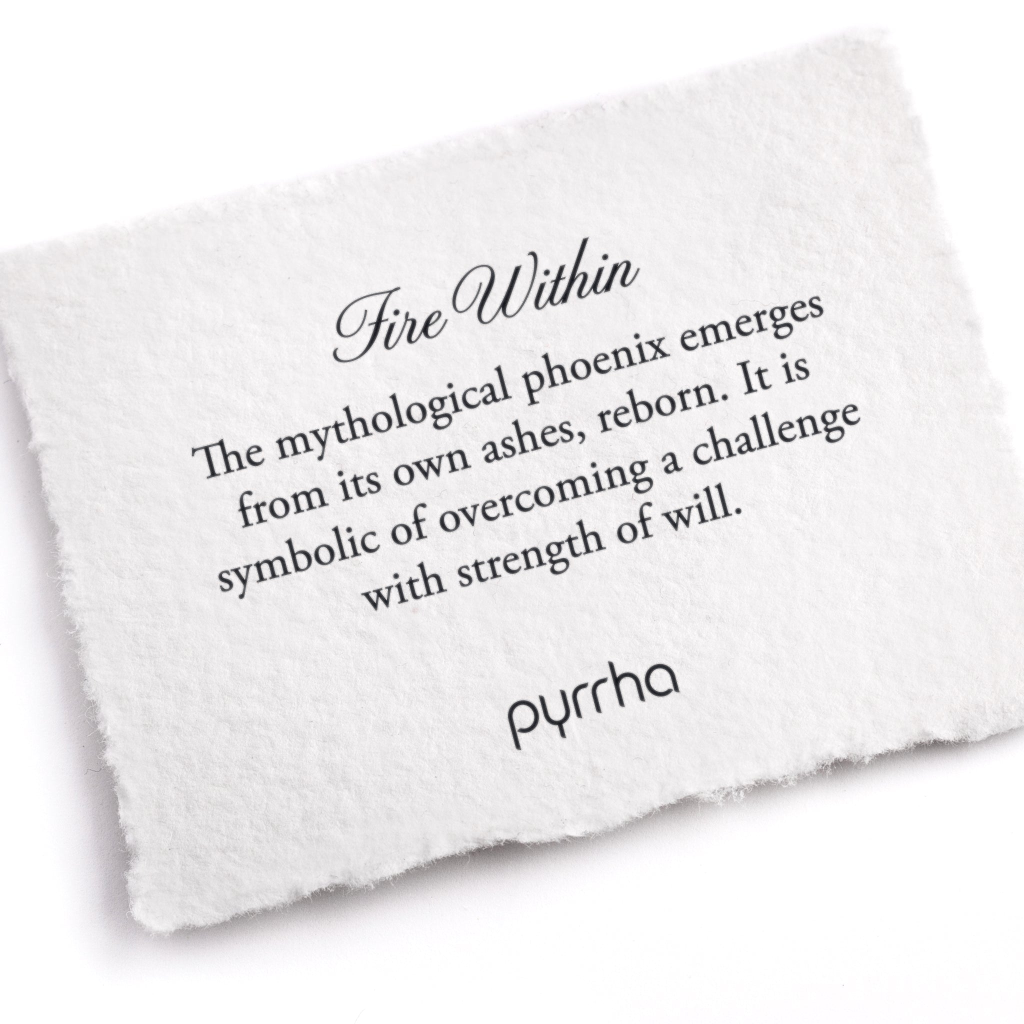 A hand-torn, letterpress printed card describing the meaning for Pyrrha's Fire Within Talisman