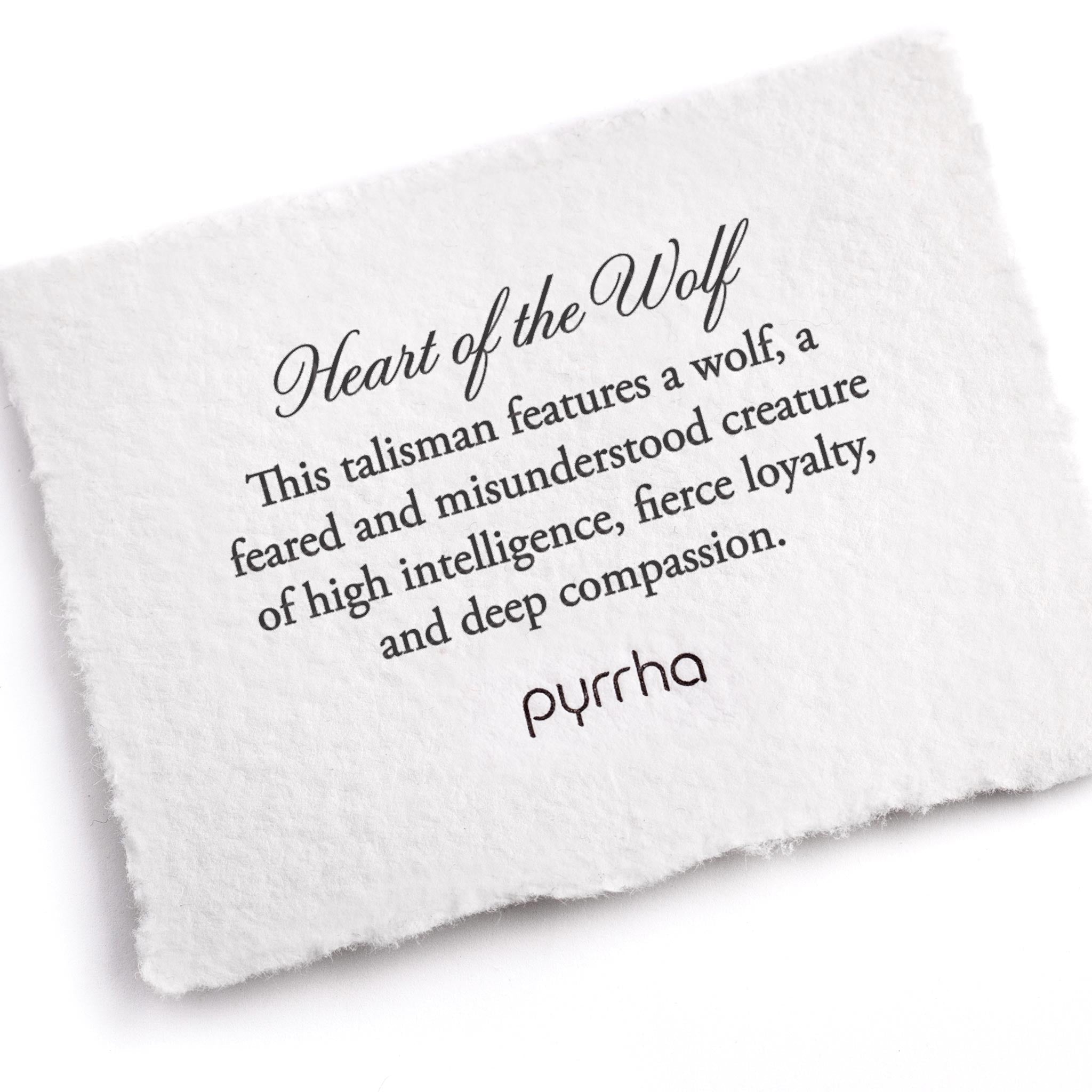 A hand-torn, letterpress printed card describing the meaning for Pyrrha's Heart of the Wolf Talisman