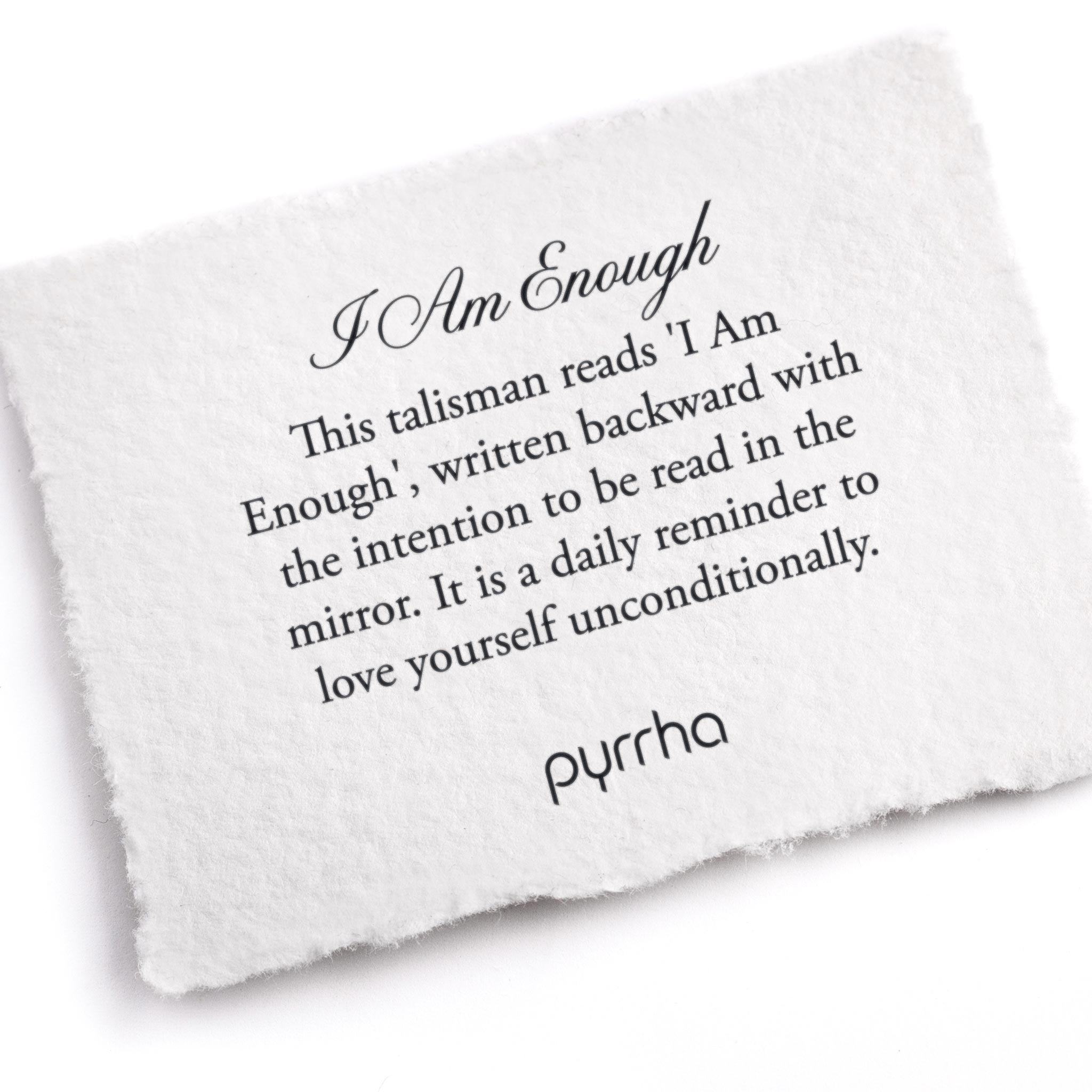 A hand-torn, letterpress printed card describing the meaning for Pyrrha's I Am Enough Talisman