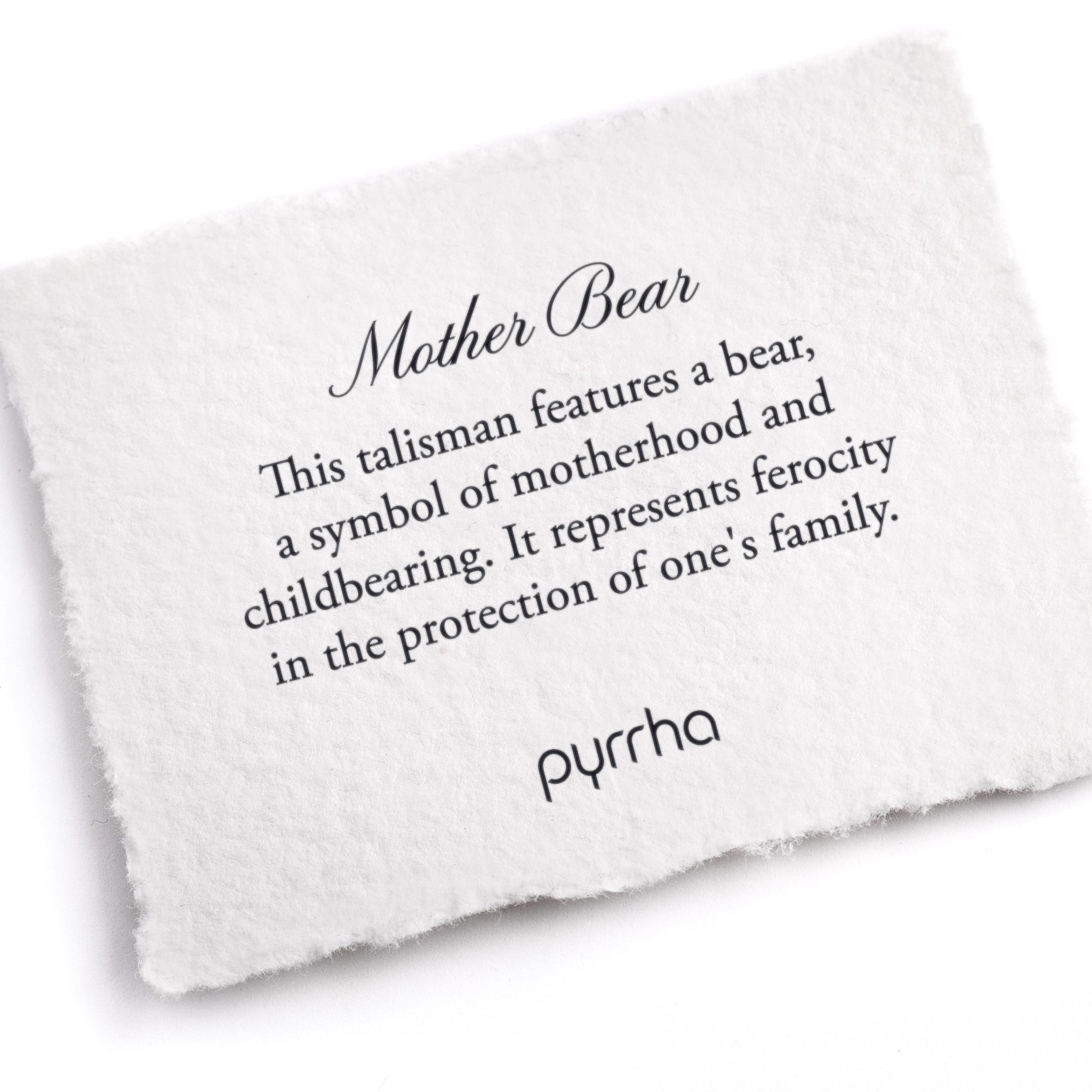 A hand-torn, letterpress printed card describing the meaning for Pyrrha's Mother Bear Talisman