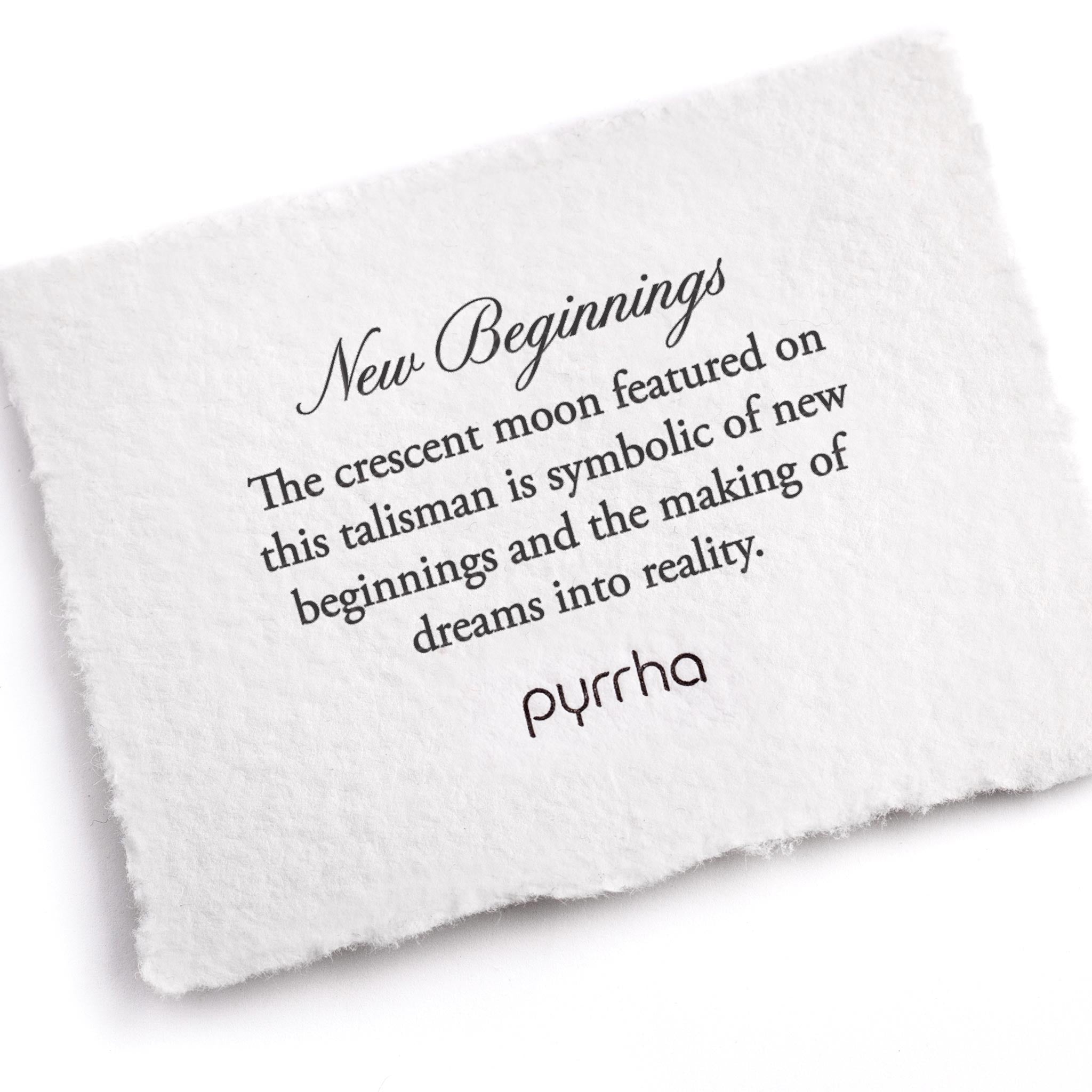 A hand-torn, letterpress printed card describing the meaning for Pyrrha's New Beginnings Talisman