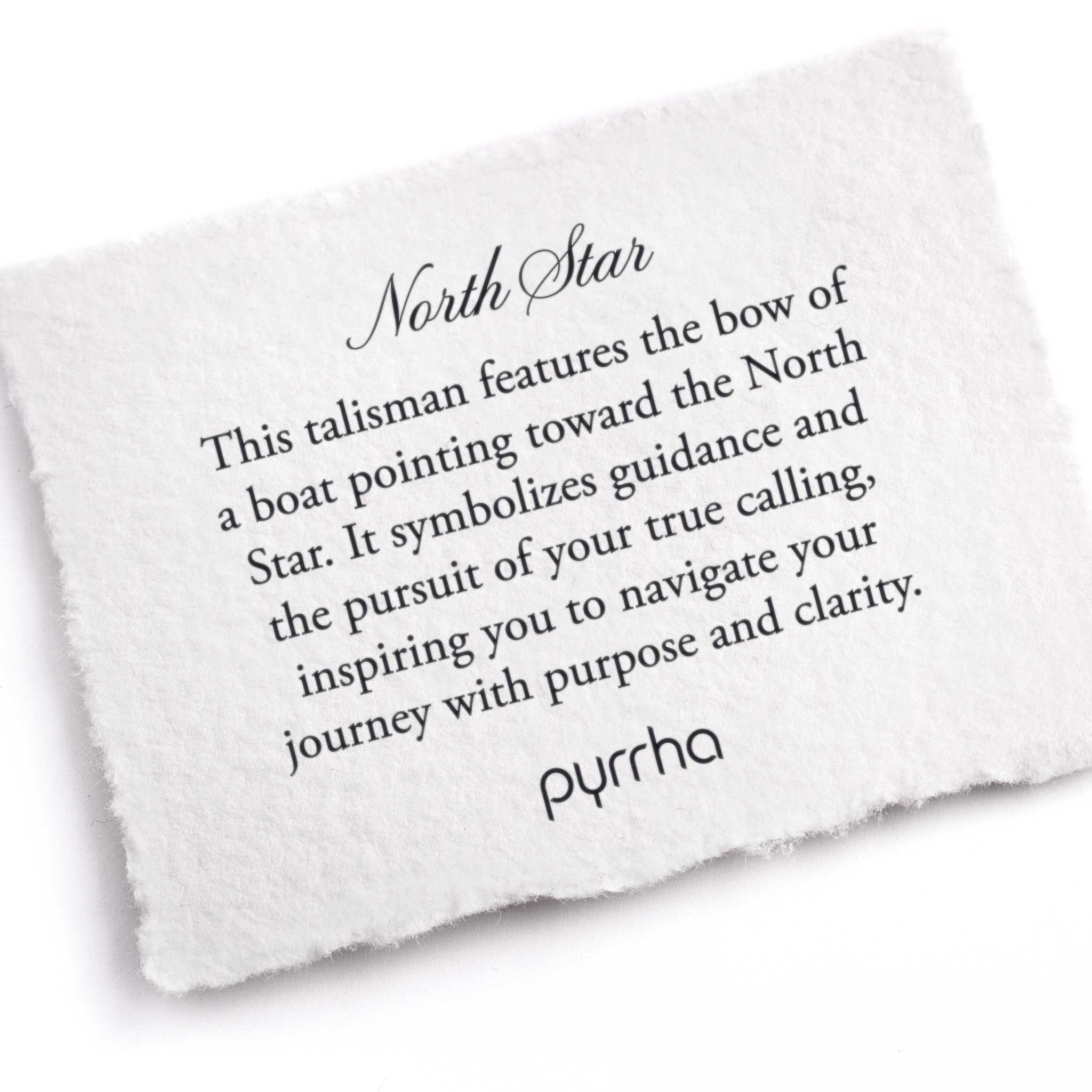 A hand-torn, letterpress printed card describing the meaning for Pyrrha's North Star Talisman