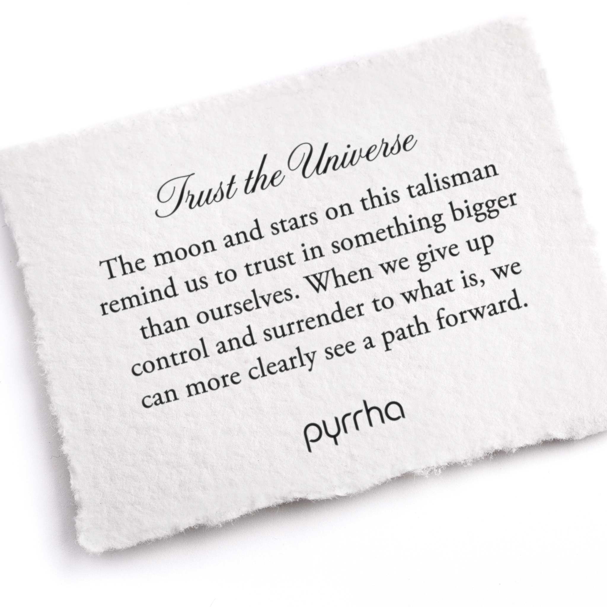 A hand-torn, letterpress printed card describing the meaning for Pyrrha's Trust the Universe Talisman