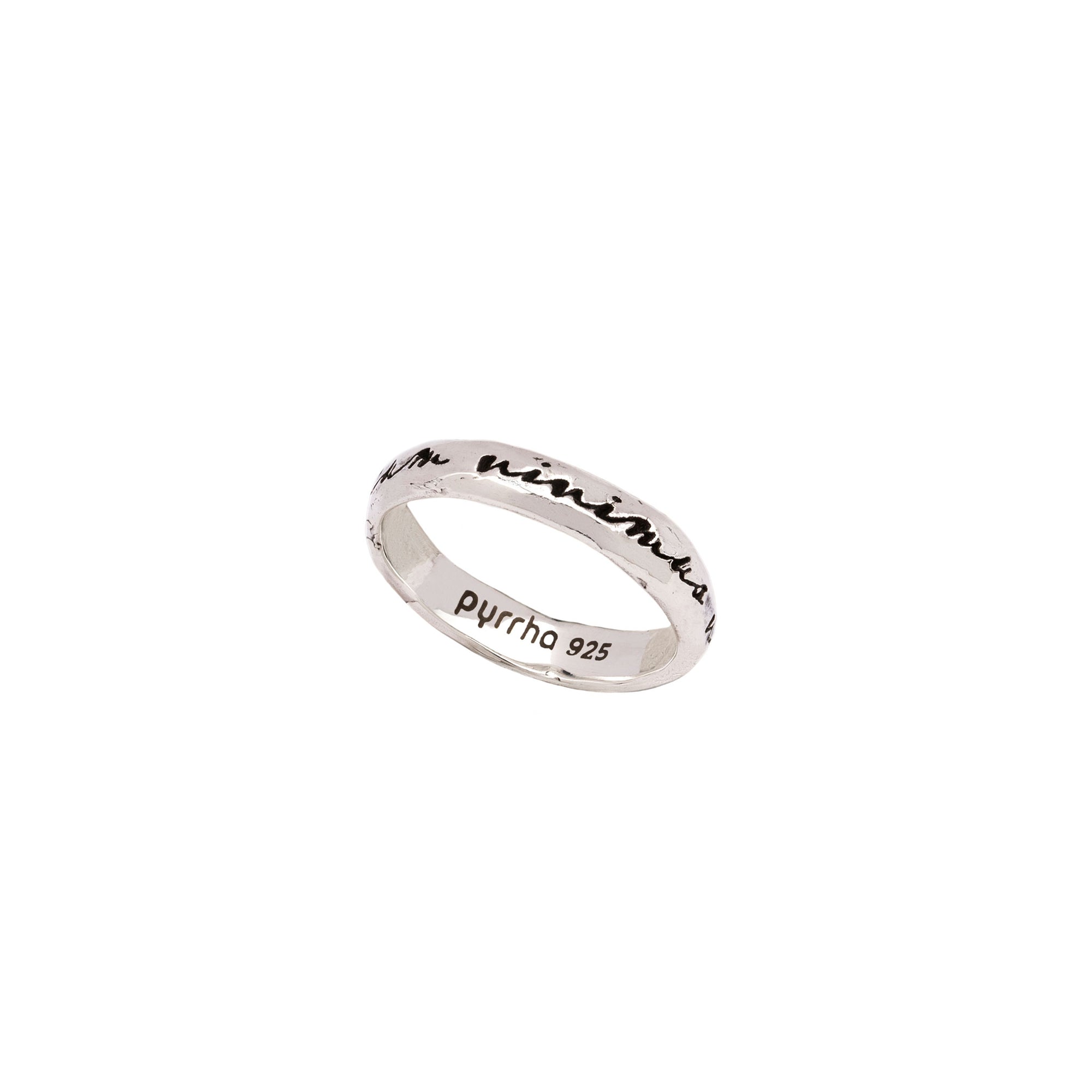 An silver band ring engraved with latin meaning while we live let us live