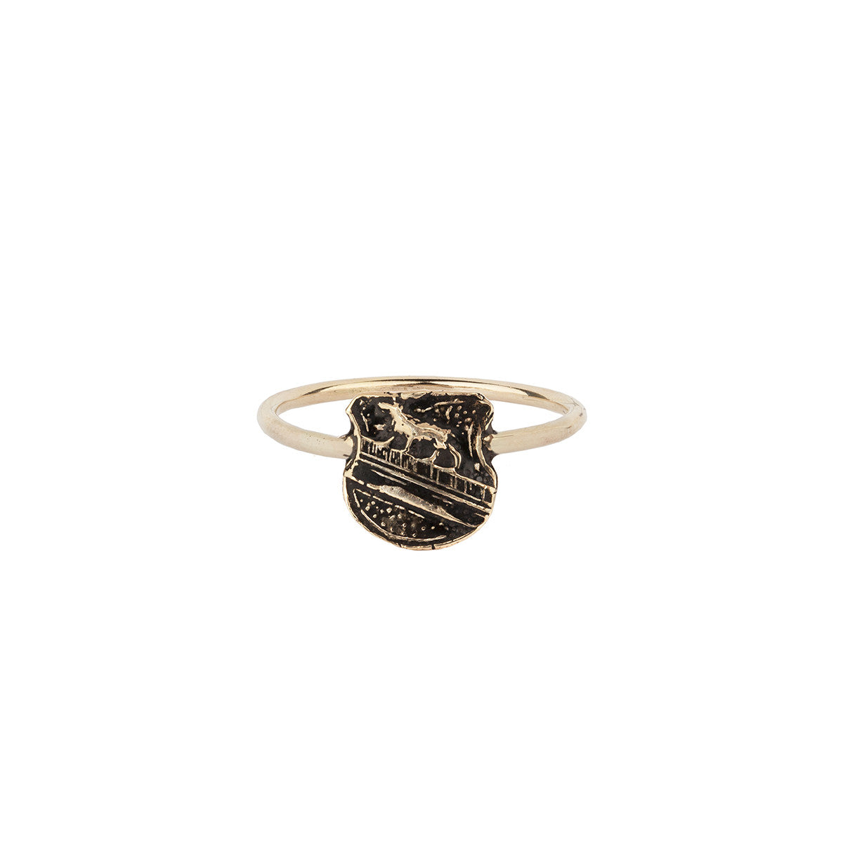 A 14k gold band ring with our gold Heart of the Wolf mini talisman.