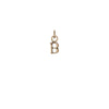 A 14k gold charm in the shape of the letter "B".