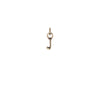 A 14k gold charm in the shape of the letter "J".