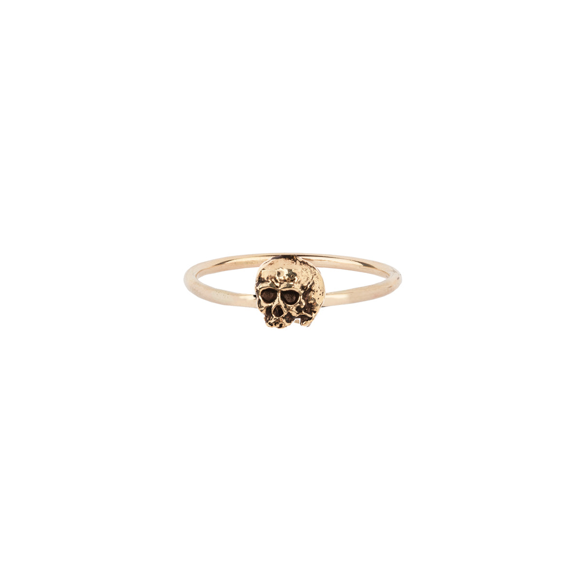 A 14k gold band ring with a Skull symbol charm.