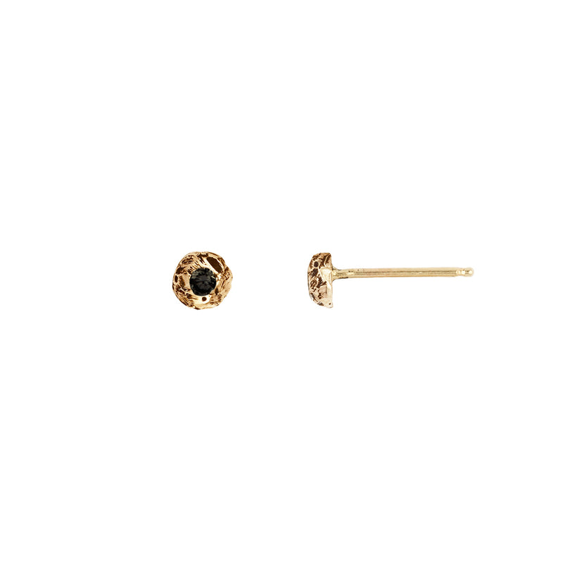 A set of 14k gold stud earrings featuring white diamonds set on large gold nuggets.