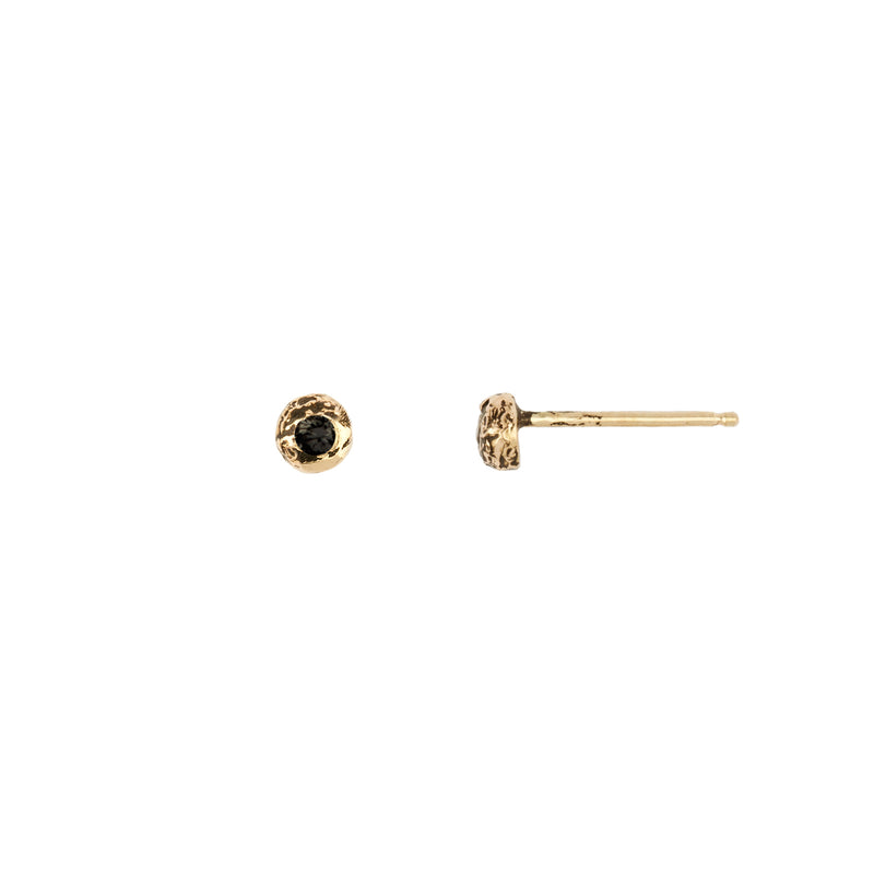 A set of 14k gold stud earrings set with a white diamond.