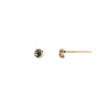 A set of 14k gold stud earrings set with a sapphire.