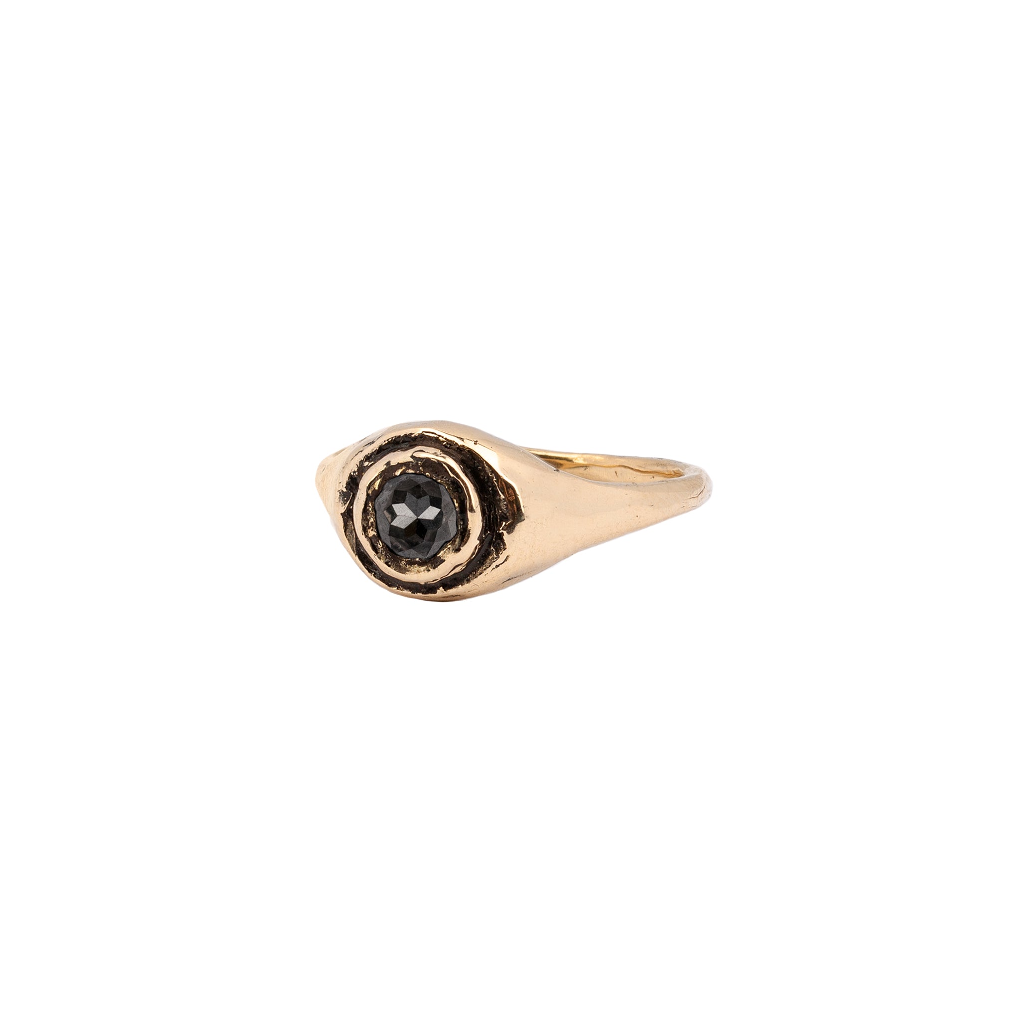 A 14k gold signet ring set with a charcoal diamond.