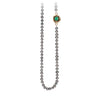 A necklace of hand strung dove grey pearls with a 14k gold bezel set emerald.