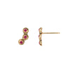 A set of 14k gold stud earrings set with three rubies.