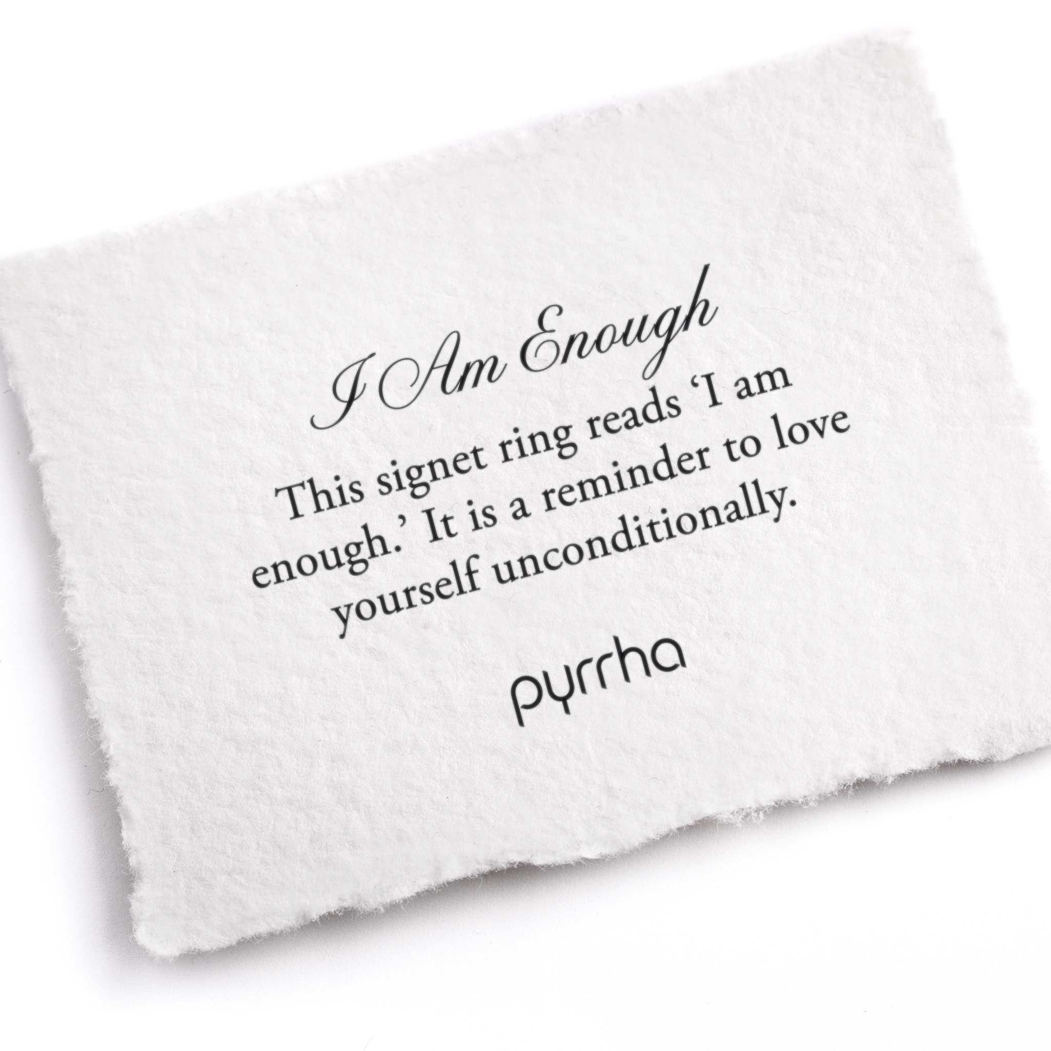 A hand-torn, letterpress printed card describing the meaning for Pyrrha's I Am Enough Signet Ring