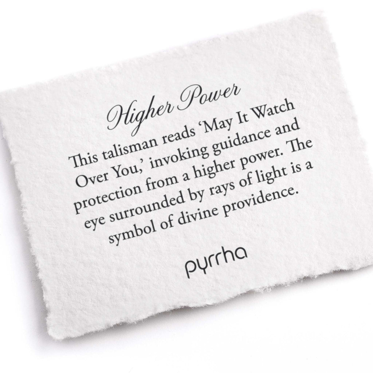A hand-torn, letterpress printed card describing the meaning for Pyrrha's Higher Power 14K Gold Talisman