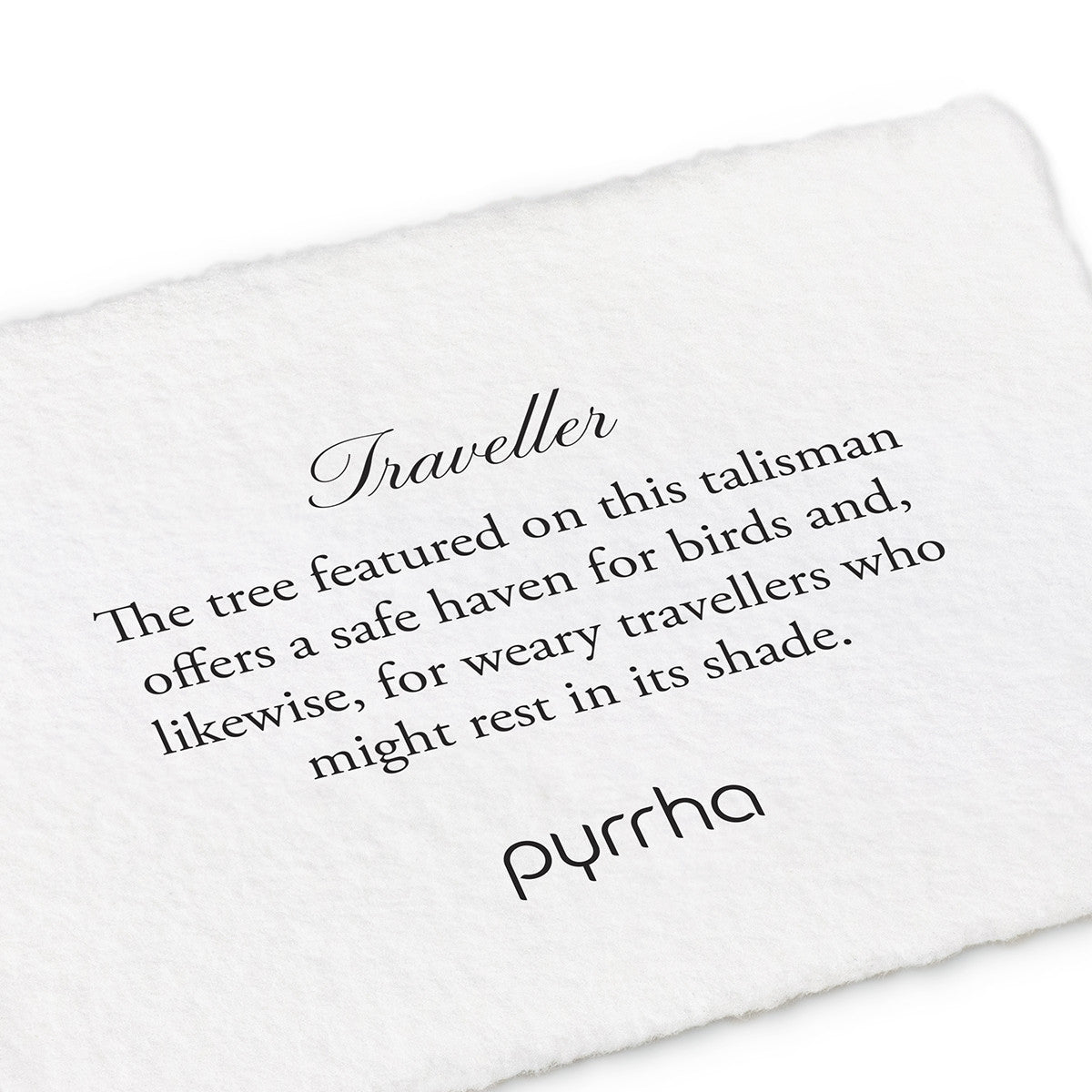 A hand-torn, letterpress printed card describing the meaning for Pyrrha's Traveller Talisman Charm