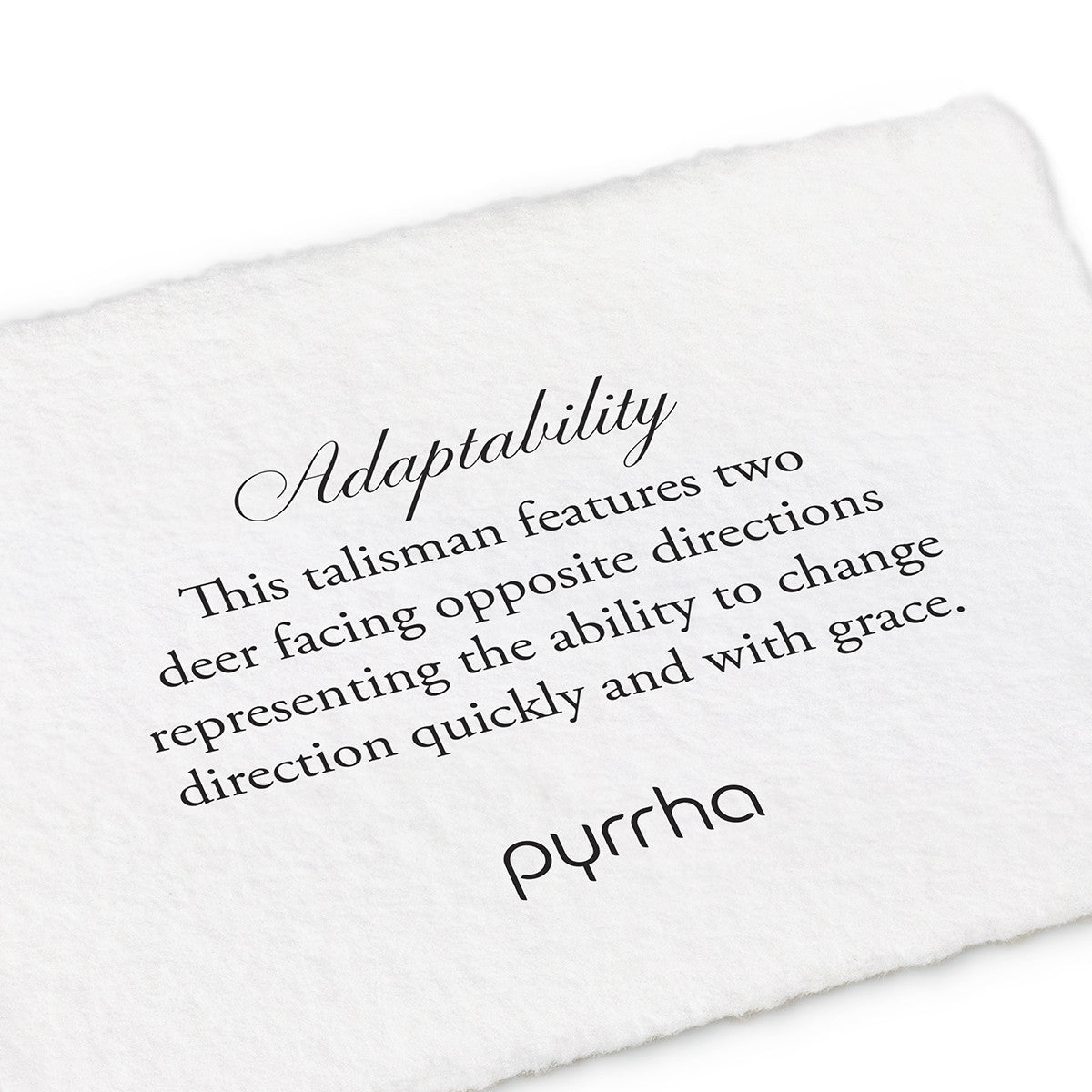 A hand-torn, letterpress printed card describing the meaning for Pyrrha's Adaptability Talisman Charm
