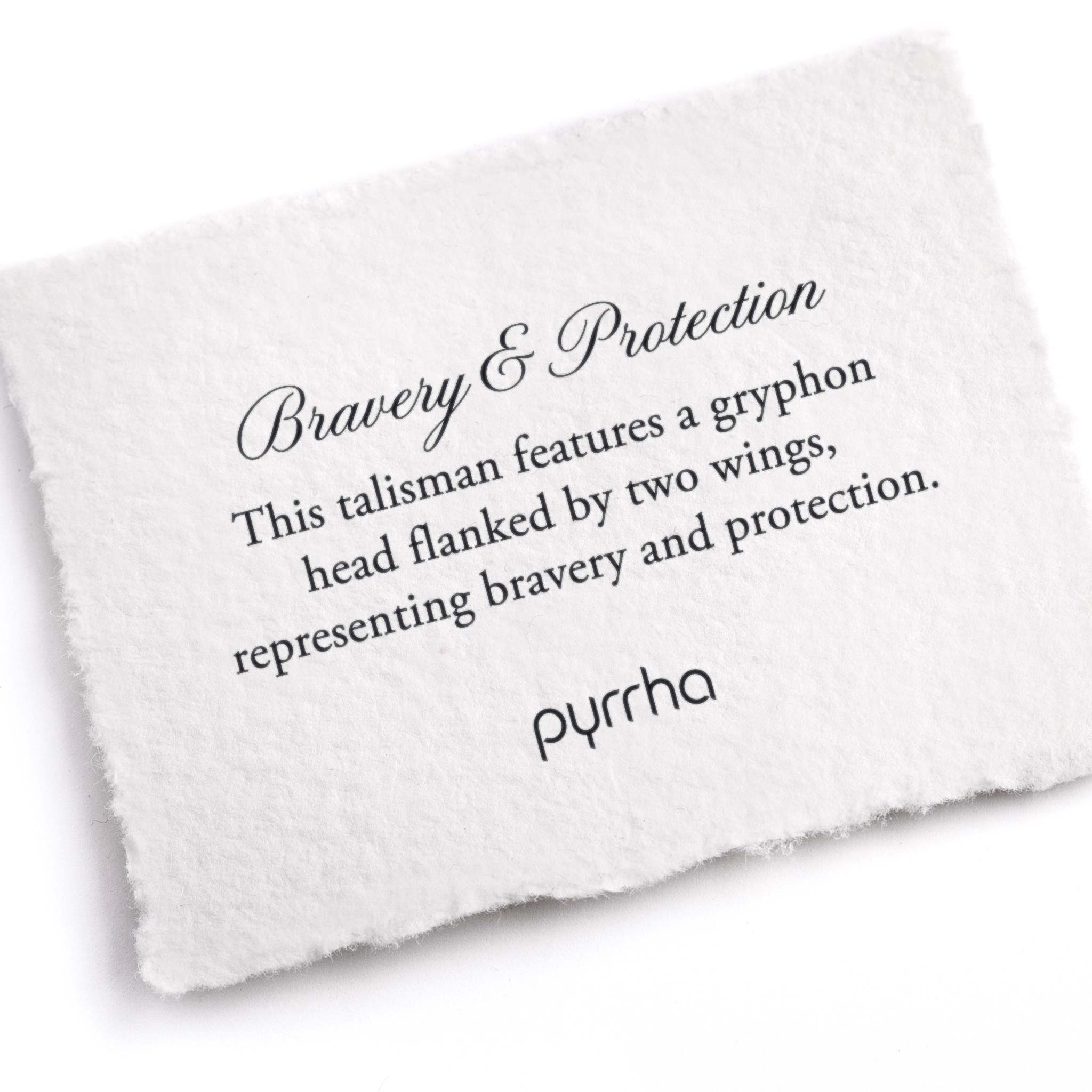 A hand-torn, letterpress printed card describing the meaning for Pyrrha's Bravery & Protection Talisman