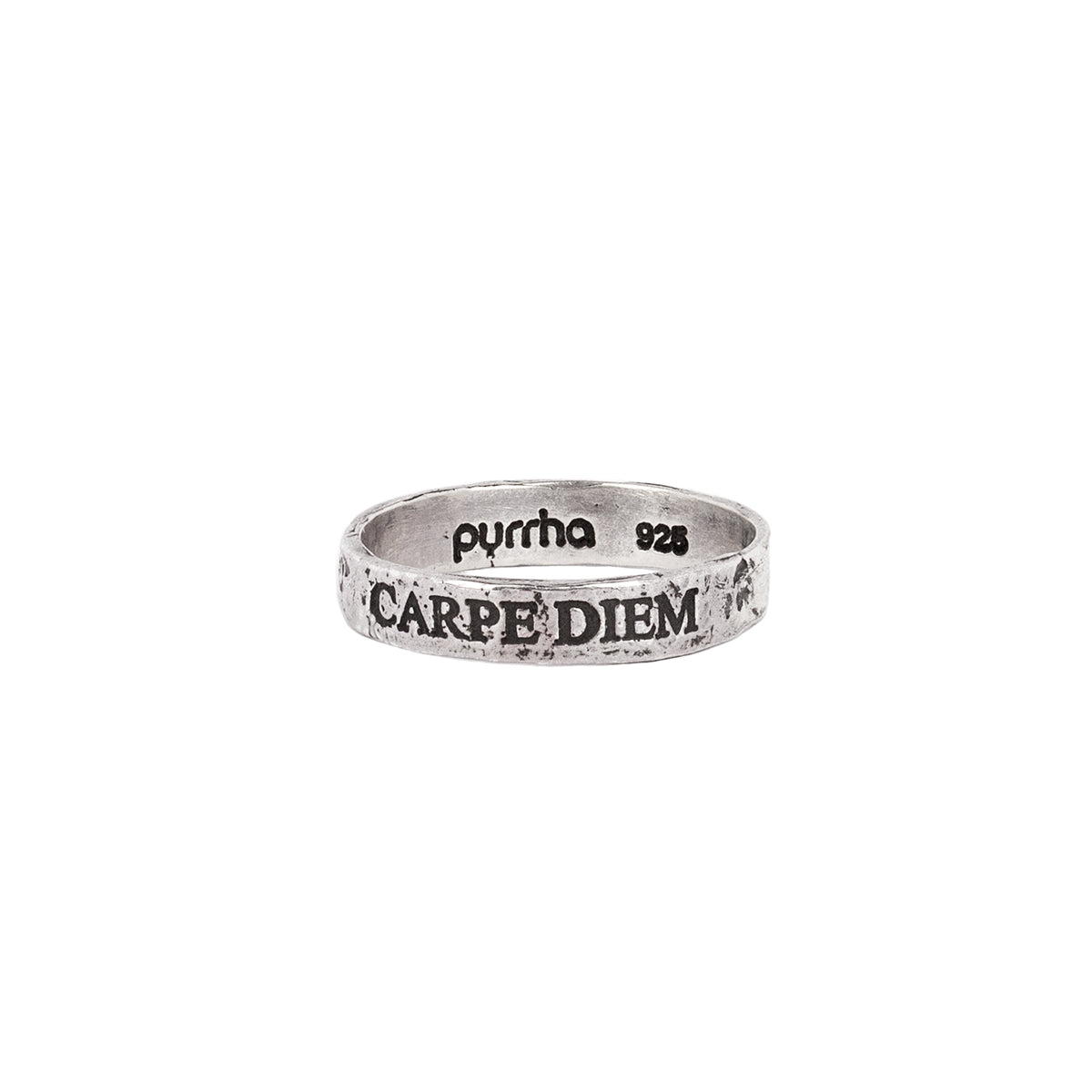 A silver band ring with the phrase Carpe Diem engraved into it