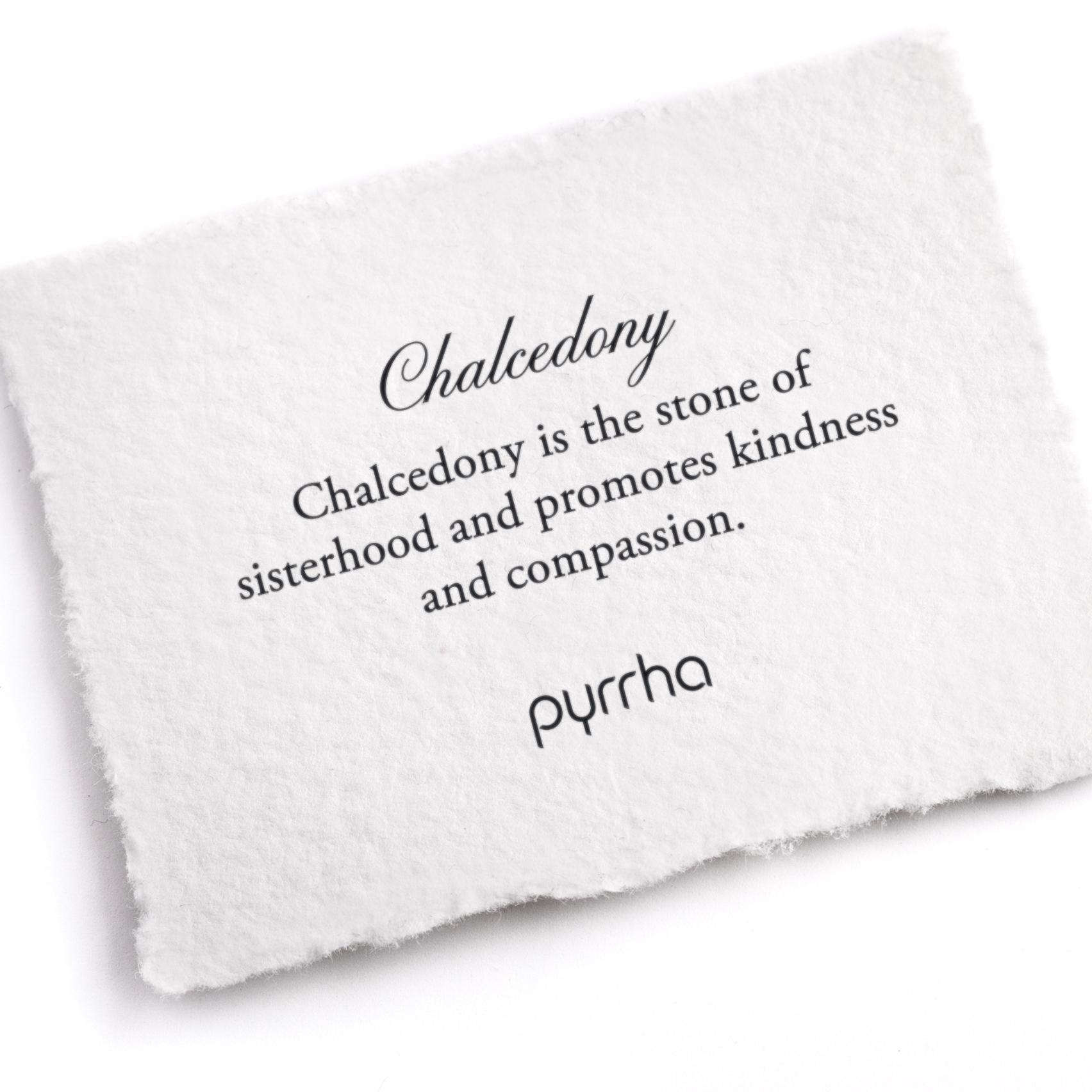 A hand-torn, letterpress printed card describing the meaning for Pyrrha's Chalcedony stone
