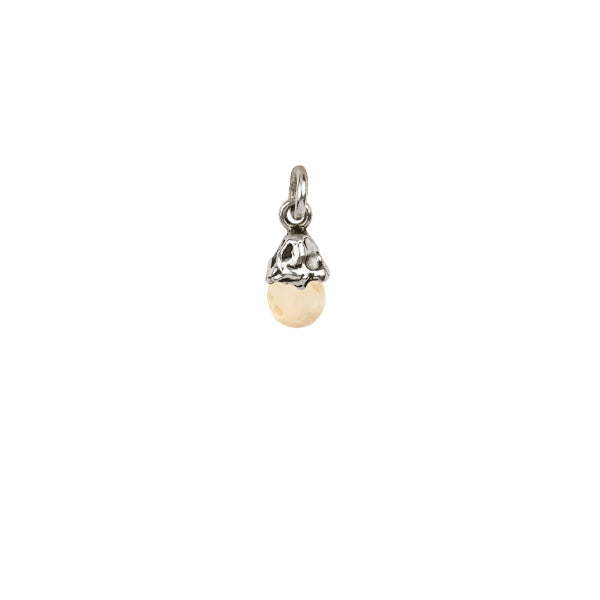 A sterling silver capped charm representing confidence.