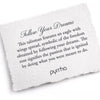 A hand-torn, letterpress printed card describing the meaning for Pyrrha's Follow Your Dreams Talisman Necklace
