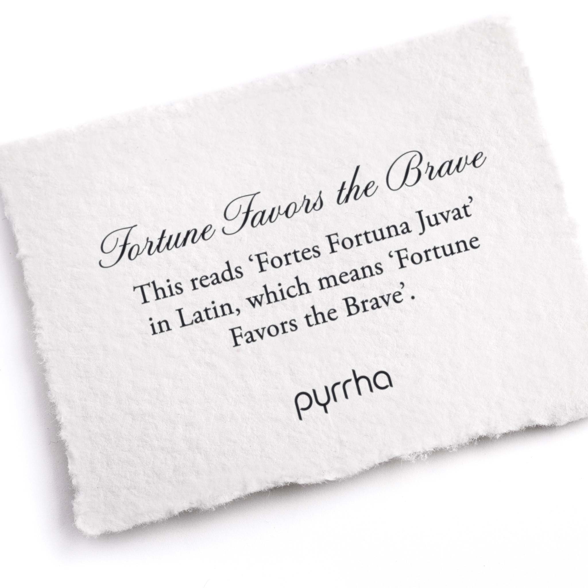 A hand-torn, letterpress printed card describing the meaning for Pyrrha's Fortune Favors the Brave Latin Motto Band Ring