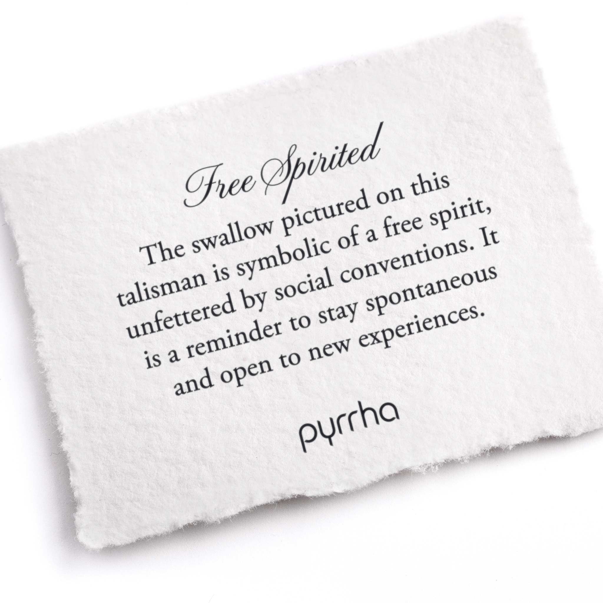 A hand-torn, letterpress printed card describing the meaning for Pyrrha's Free Spirited Talisman