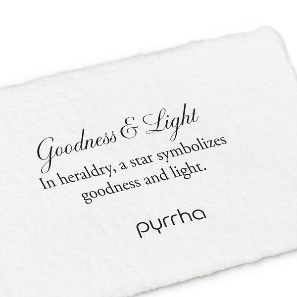 A hand-torn, letterpress printed card describing the meaning for Pyrrha's Goodness & Light Shield Charm