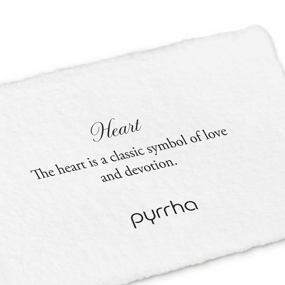 A hand-torn, letterpress printed card describing the meaning for Pyrrha's Heart Oval Signet Ring