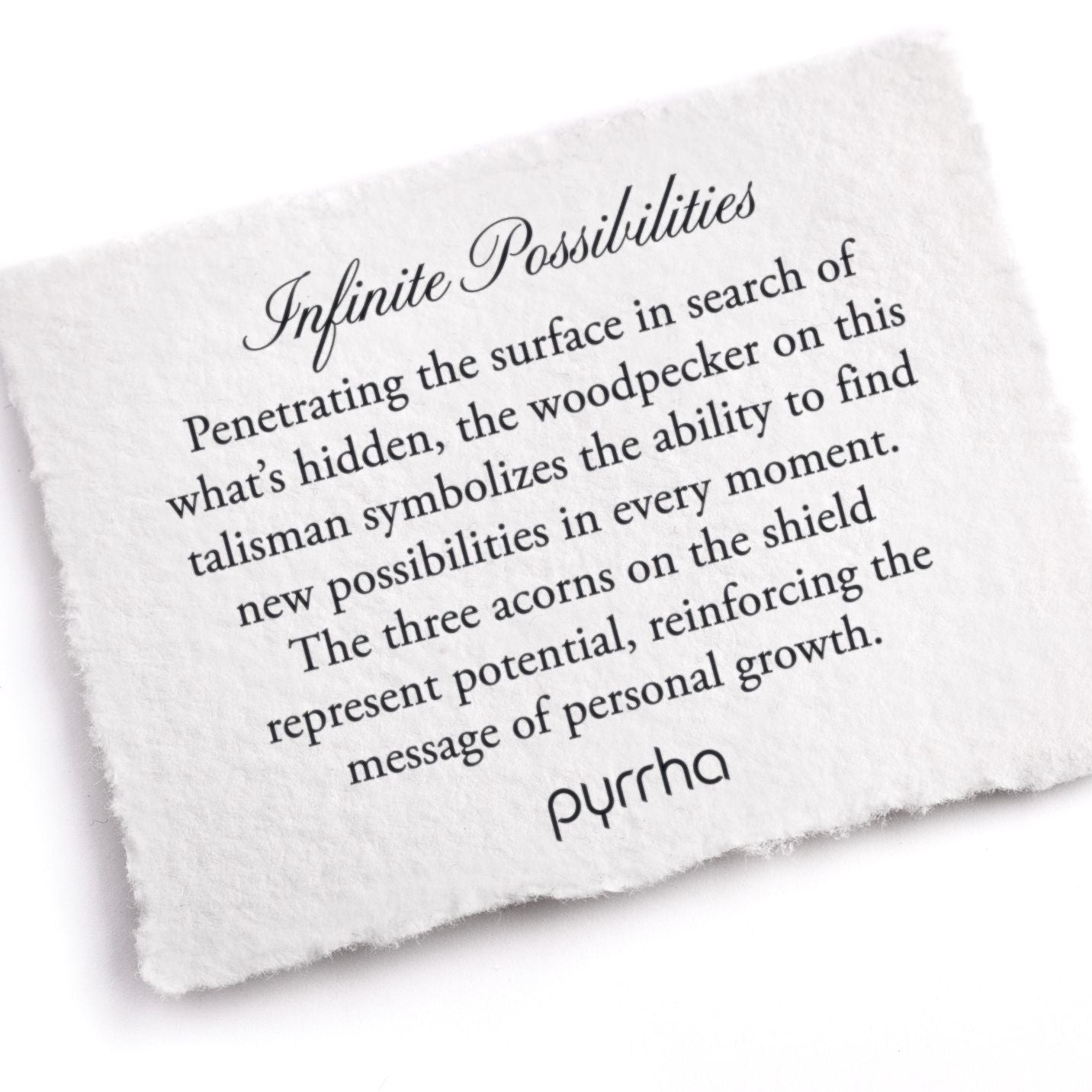 A hand-torn, letterpress printed card describing the meaning for Pyrrha's Infinite Possibilities Talisman