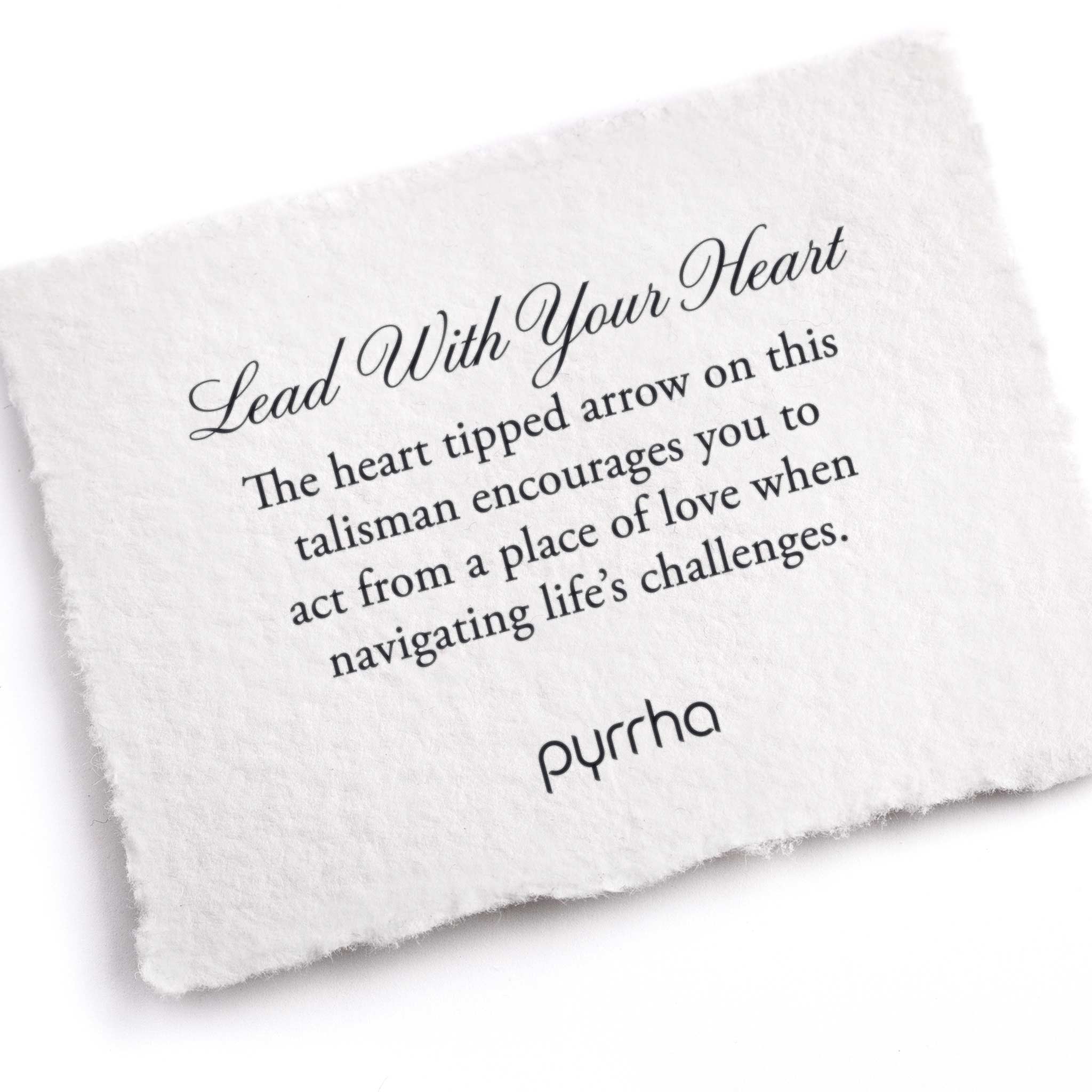 A hand-torn, letterpress printed card describing the meaning for Pyrrha's Lead With Your Heart Talisman