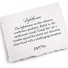 A hand-torn, letterpress printed card describing the meaning for Pyrrha's Lighthouse 14K Gold Signature Talisman