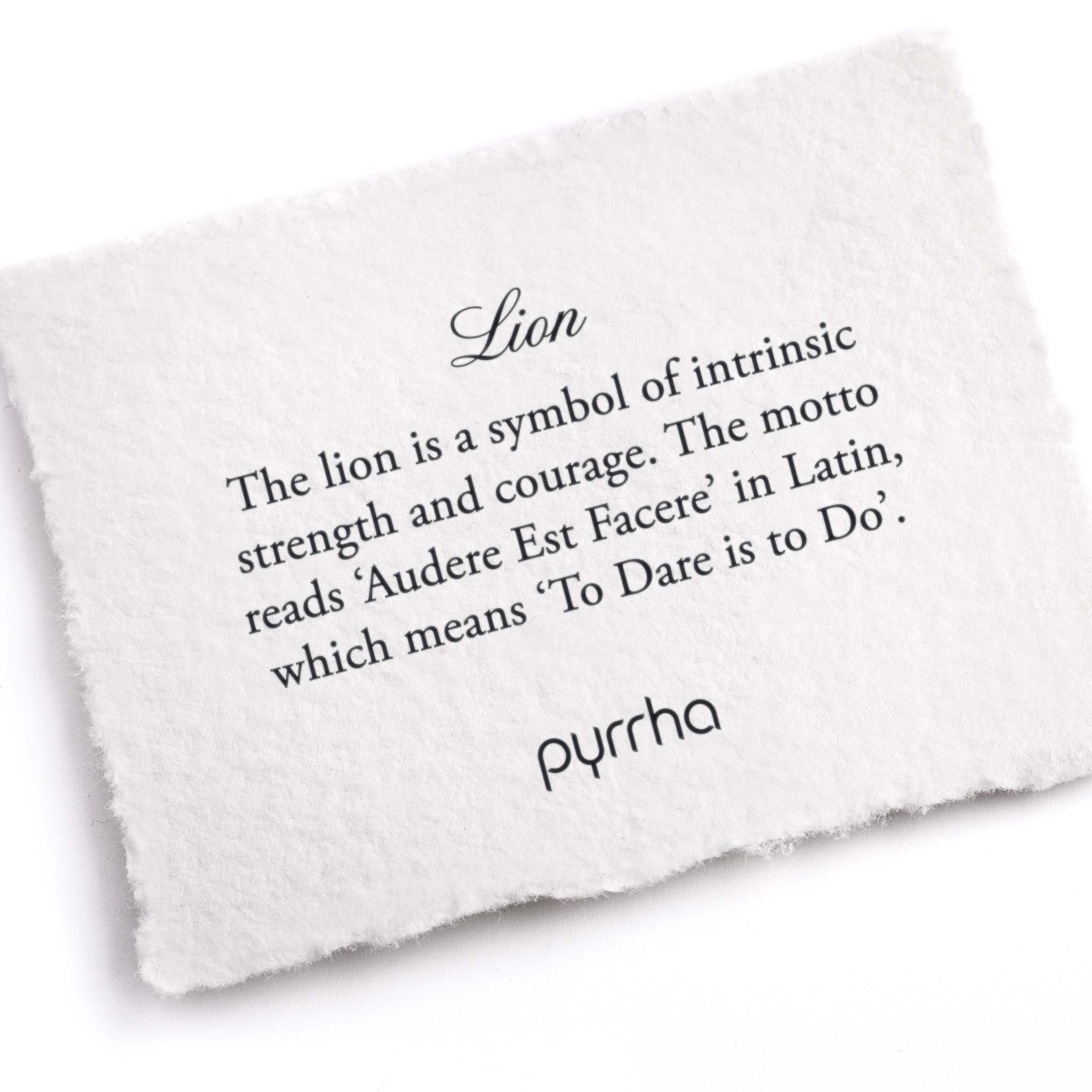 A hand-torn, letterpress printed card describing the meaning for Pyrrha's Lion Honor Badge