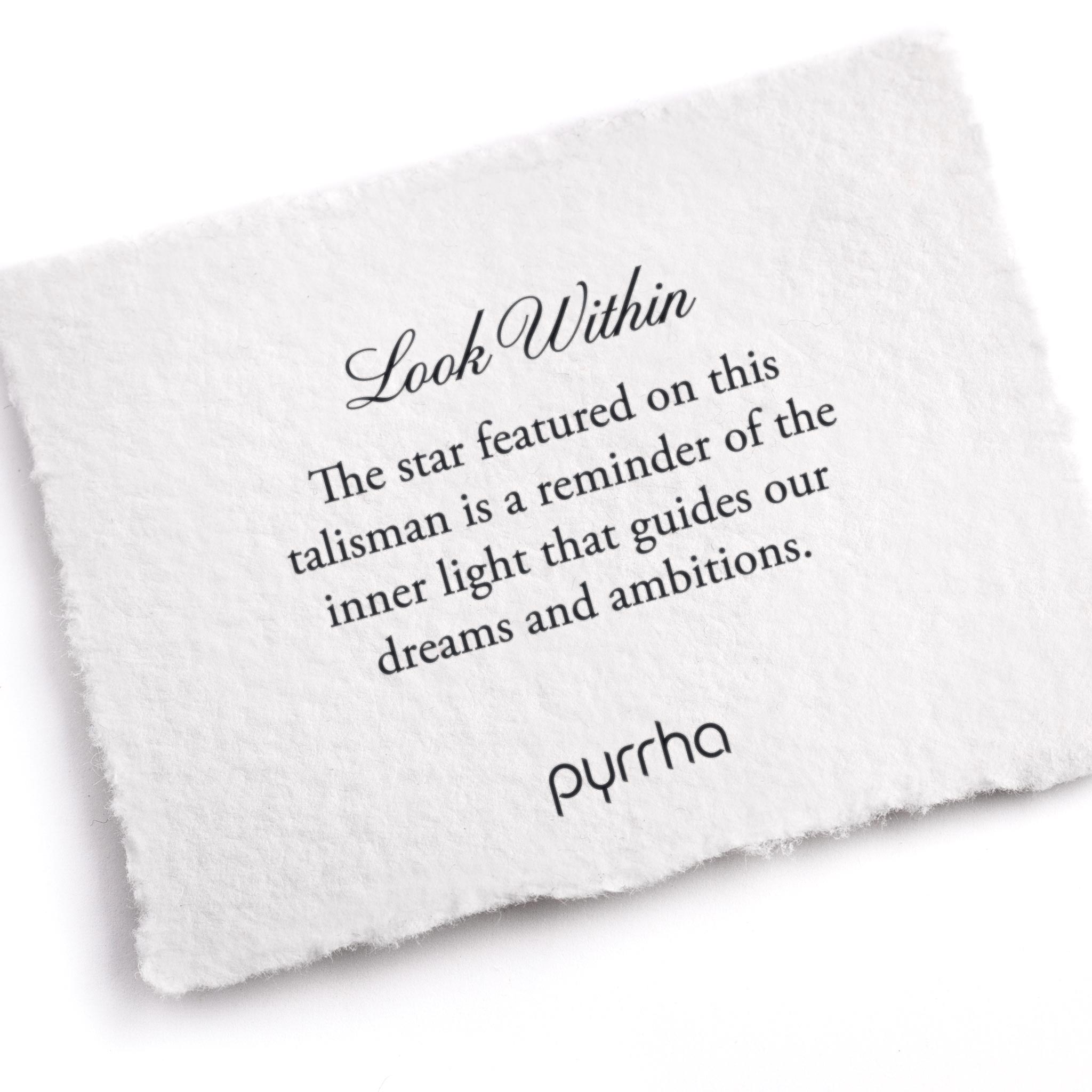 A hand-torn, letterpress printed card describing the meaning for Pyrrha's Look Within Talisman