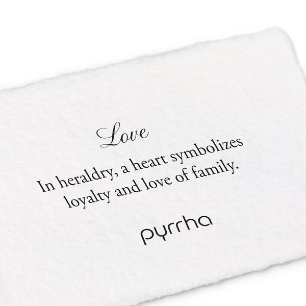 A hand-torn, letterpress printed card describing the meaning for Pyrrha's Love Color Shield Charm