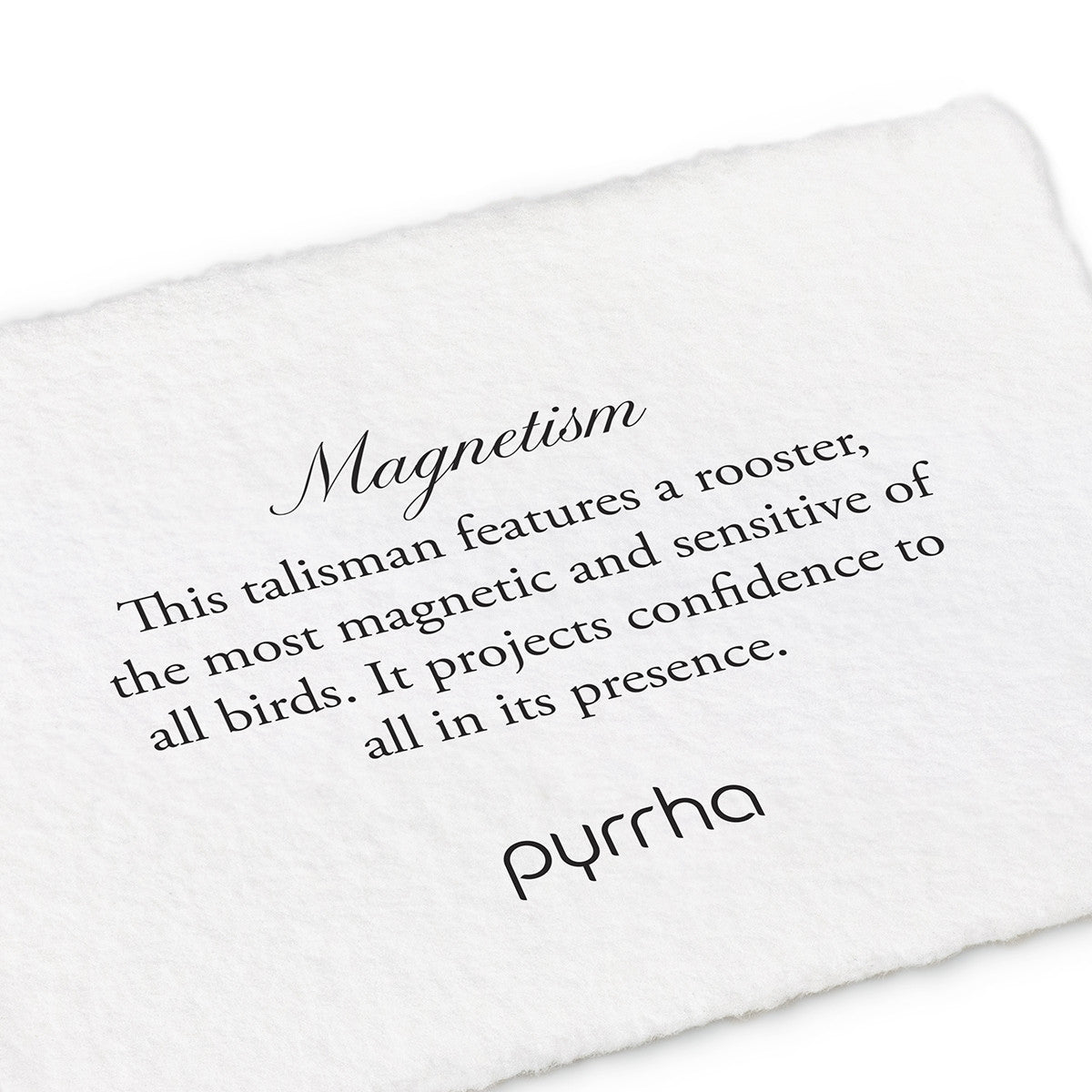 A hand-torn, letterpress printed card describing the meaning for Pyrrha's Magnetism Talisman