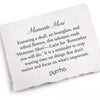 A hand-torn, letterpress printed card describing the meaning for Pyrrha's Memento Mori 14K Gold Signature Talisman