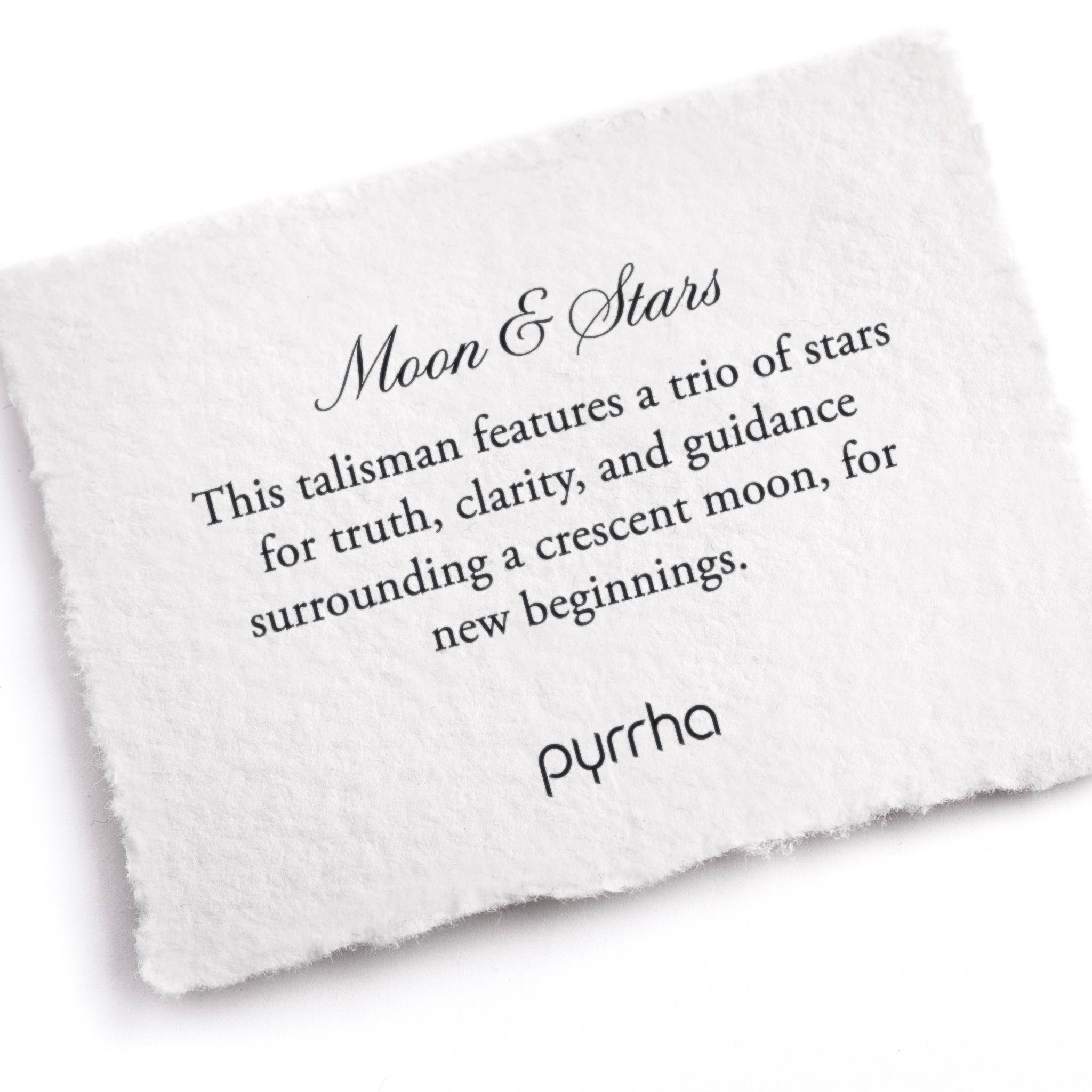 A hand-torn, letterpress printed card describing the meaning for Pyrrha's Moon & Stars Talisman
