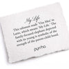 A hand-torn, letterpress printed card describing the meaning for Pyrrha's My Life Signature Talisman Necklace