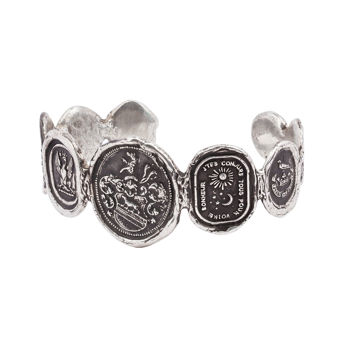 A narrow silver cuff made of multiple silver talismans. This cuff features the Heart of the Wolf talisman in the center.