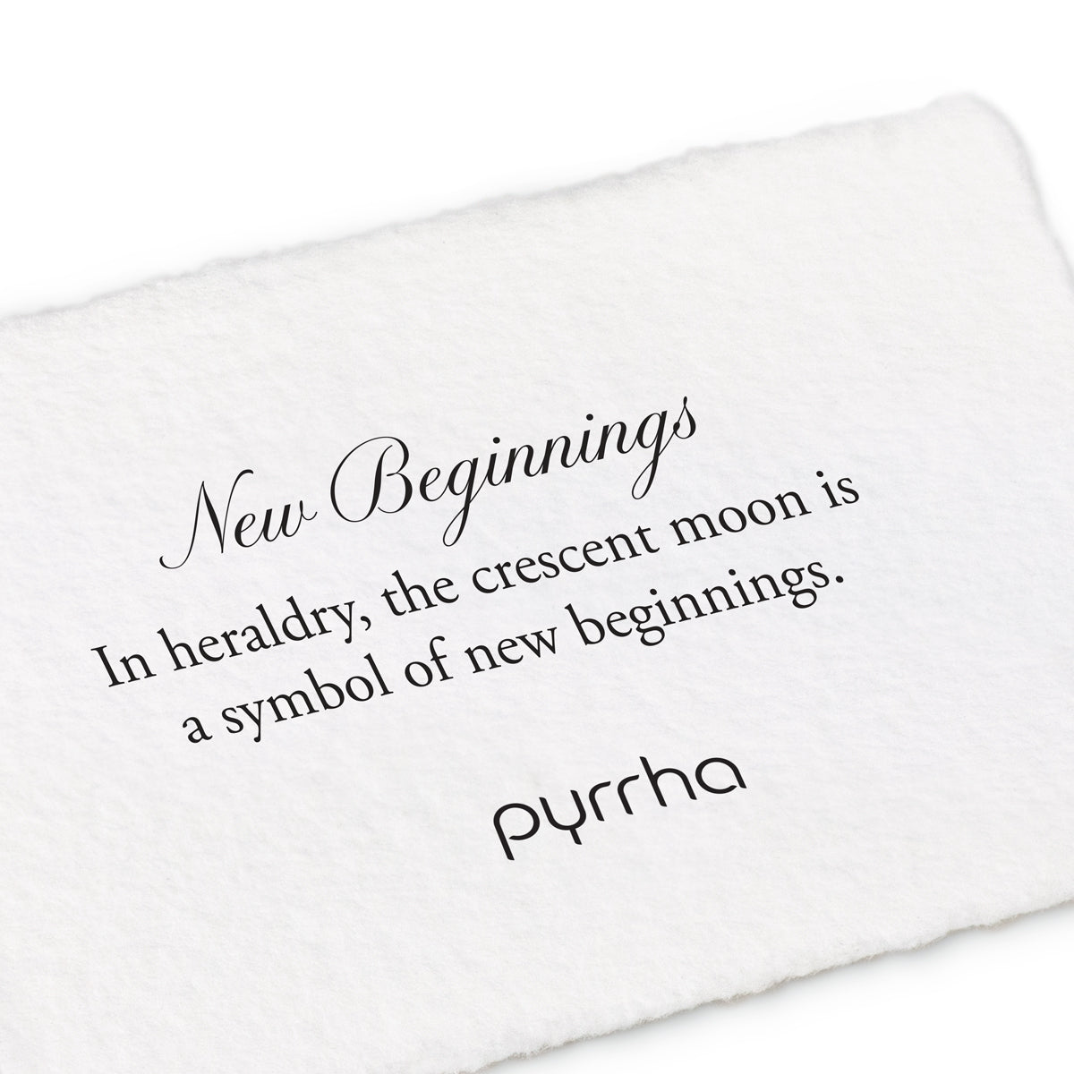 A hand-torn, letterpress printed card describing the meaning for Pyrrha's New Beginnings Shield Charm