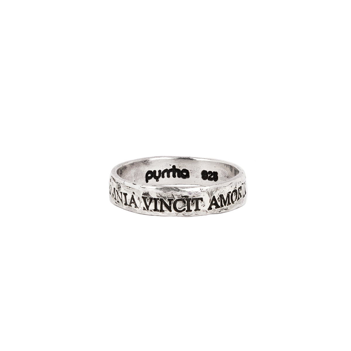 A silver band ring with the phrase Omnia Vincit Amor engraved into it