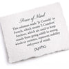A hand-torn, letterpress printed card describing the meaning for Pyrrha's Peace of Mind Talisman