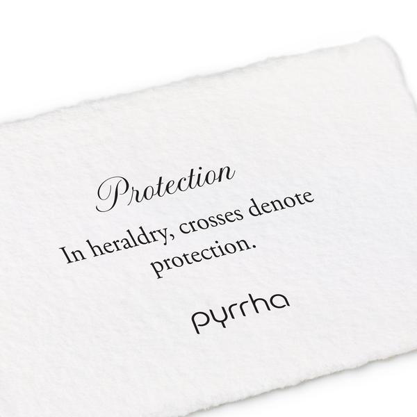 A hand-torn, letterpress printed card describing the meaning for Pyrrha's Protection Color Shield Charm